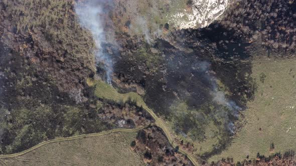 Aerial scene of wildfire spreading over the hill 4K video