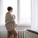 Self loving middle aged brunette woman in underwear near window in bedroom at home - PhotoDune Item for Sale