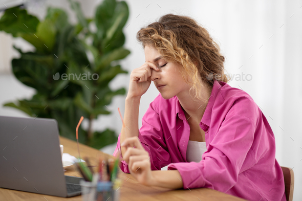 Tired Female Feeling Eyes Strain After Working With Laptop At Home Office