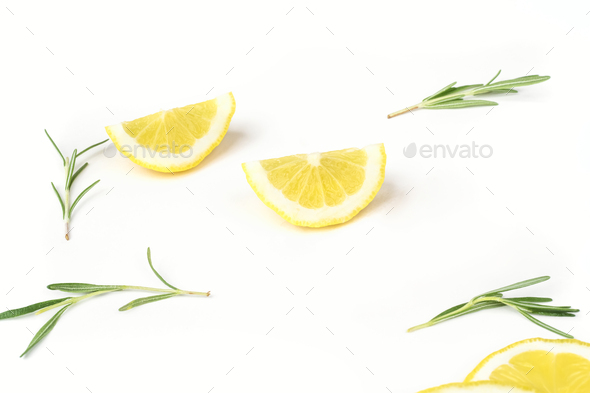 Lemon slices and rosemary on a white background - Stock Photo - Images