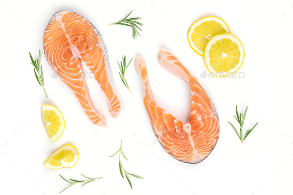 Fresh raw salmon slices with lemon and rosemary on a white background - Stock Photo - Images