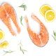 Fresh raw salmon slices with lemon and rosemary on a white background - PhotoDune Item for Sale