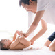Asian father is changing diapper for his little baby boy in the morning time - PhotoDune Item for Sale