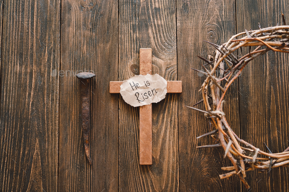 He is Risen. Jesus Crown Thorns and nails and cross on a wood background. Easter Day