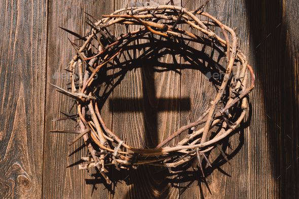 Jesus Crown Thorns and nails and cross on a wood background. Easter Day