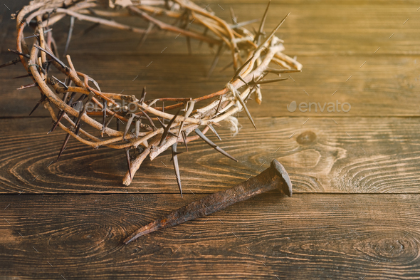 Jesus Crown Thorns and nails and cross on a wood background. Easter Day