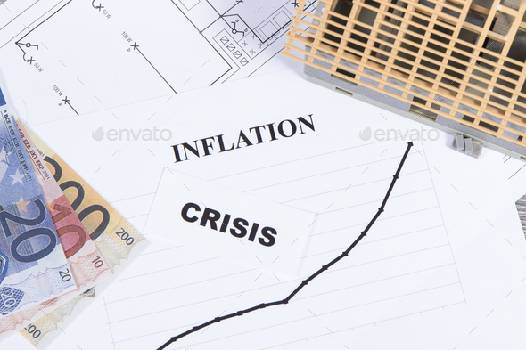 Inscriptions crisis and inflation, currencies Euro, toy house under construction