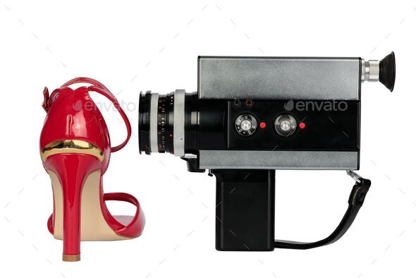 Heel cinema, women's cinema, film. Conceptual image. Red, sexy high heels and camera.