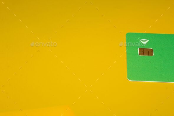 Blank card with a brown square chip and a WiFi symbol, concept of contactless payment