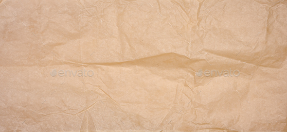 Crumpled brown parchment paper, close up Stock Photo by ndanko