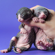 Cattery female worker shows two weeks old bicolor kittens of Canadian Sphynx on blue background - PhotoDune Item for Sale