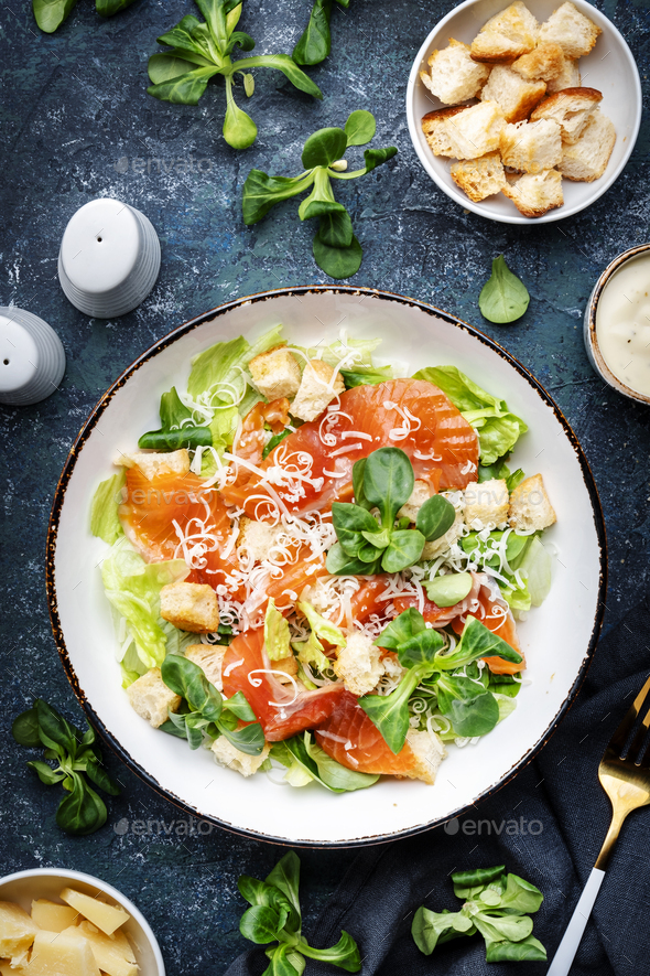 Caesar salad with salted salmon, iceberg and lamb lettuce, croutons