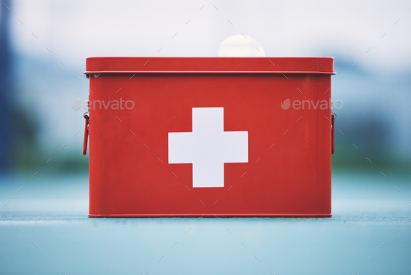 First aid, box and medical equipment for health emergency, response and treatment kit isolated in a