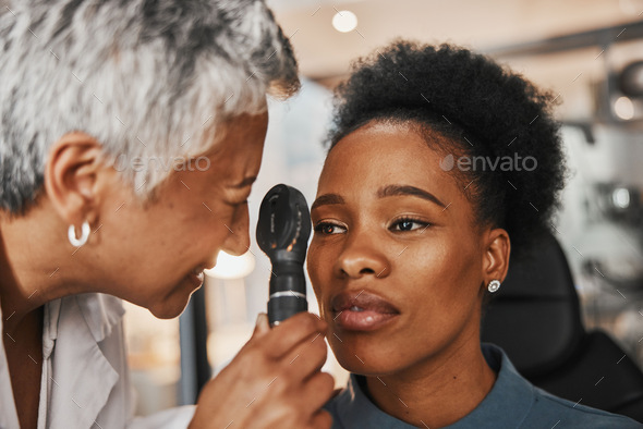 Laser, senior doctor or black woman in eye exam for eyesight at optometrist office. Mature optician