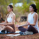 Yoga, outdoor meditation and women exercise in nature for fitness