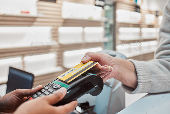 Hands, credit card and machine for payment, banking transaction or ecommerce at eye clinic or store