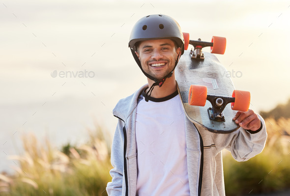 Smile, longboard and portrait of man with skateboarding hobby, skill and balance on road. Freedom,
