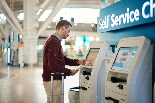 Man, airport and self service kiosk for check in, ticket registration or online boarding pass. Male