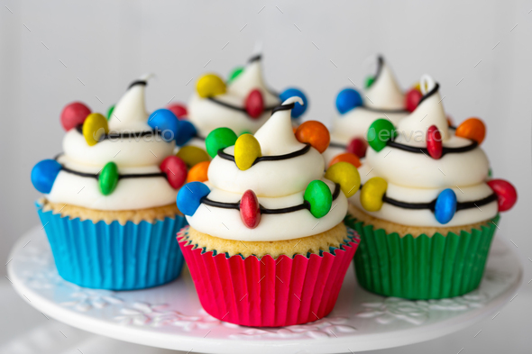 Christmas cupcakes decorated with colorful candy Christmas lights - Stock Photo - Images