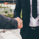 Close up professional businessmen shake hand with partner - PhotoDune Item for Sale