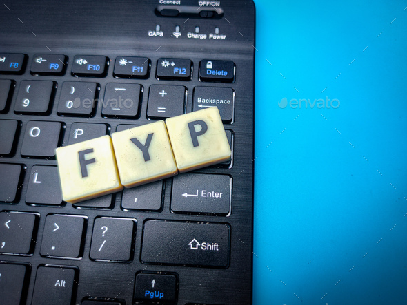 Wireless keyboard and toys word with word FYP. Business concept. - Stock Photo - Images