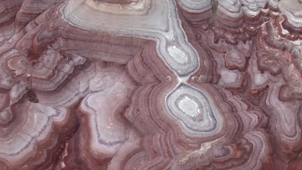 Aerial view of colorful texture in the eroded desert terrain alt