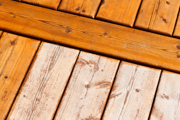 Wooden deck pattern partially stained transparent