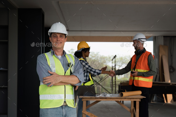 Portrait of a confident male engineer, builder and architecture at the construction site, Behind - Stock Photo - Images