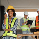 Portrait of female engineer holding walkie talkie and male engineer with working together - PhotoDune Item for Sale