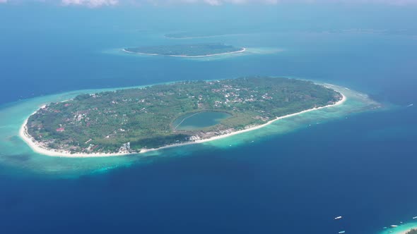 Gili Island with Lovely Tiny Buildings Surrounded By Green Forest Indonesia alt