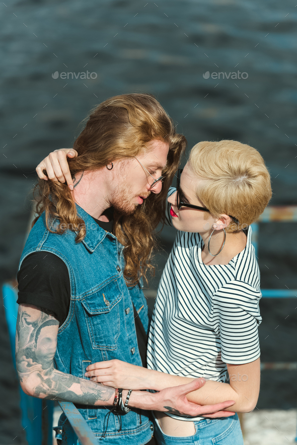 Boyfriend With Tattoos And Stylish Girlfriend Hugging On Street Stock  Photo, Picture and Royalty Free Image. Image 106072305.