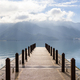 Large blue lake surrounded by mountains with pier in the morning at sun moon lake of Taiwan - PhotoDune Item for Sale
