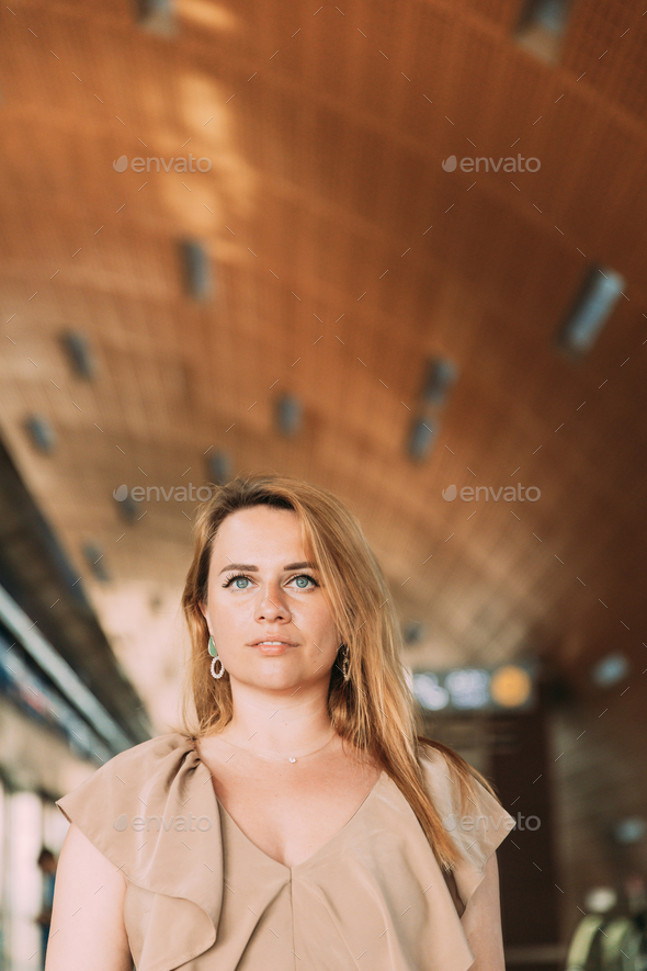 Portrait of young caucasian woman lady tourist traveler standing on the Dubai metro train station - Stock Photo - Images