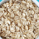 Close up picture of organic oat flakes in a bowl, selective focus. - PhotoDune Item for Sale