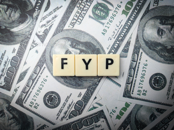 Toys word and banknotes with the word FYP. Busienss concept. - Stock Photo - Images