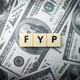 Toys word and banknotes with the word FYP. Busienss concept. - PhotoDune Item for Sale