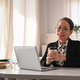 Portrait of beautiful senior businesswoman sitting in her personal office and smiling to camera. - PhotoDune Item for Sale