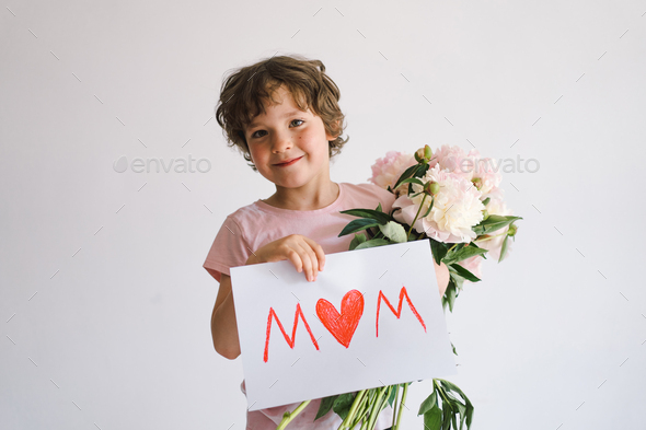 Happy Mothers Day. Cheerful happy child with Peonys bouquet. - Stock Photo - Images