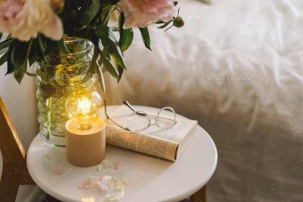Open book with glasses, cup coffee and bouquet white pink peonies flowers. Read and rest. Cozy home - Stock Photo - Images