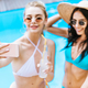beautiful young girlfriends taking selfie with smartphone at poolside - PhotoDune Item for Sale