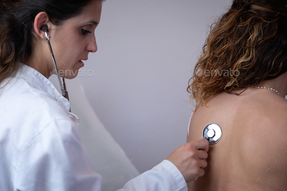Doctor visits patient in her office. - Stock Photo - Images