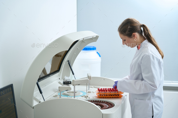 Woman conducts laboratory diagnostics in the testing unit