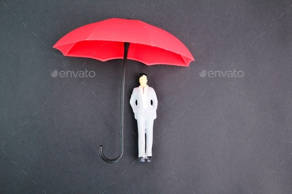 miniature people sitting under an umbrella Stock Photo by fauziEv8