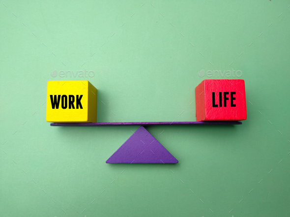 The colored triangle is in the middle balancing the words work and life. Business concept. - Stock Photo - Images