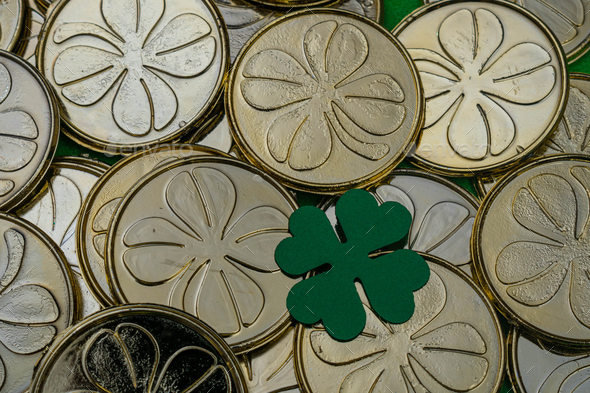 Golden coins with clovers background  - Stock Photo - Images