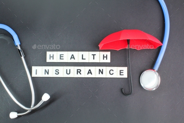stethoscope and umbrella with the alphabet word Health insurance Stock ...