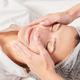Beautician massages woman face skin after rubbing moisturizing cream for rejuvenation in clinic - PhotoDune Item for Sale