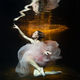 A girl underwater in the pool of a photo studio in a dress. - PhotoDune Item for Sale