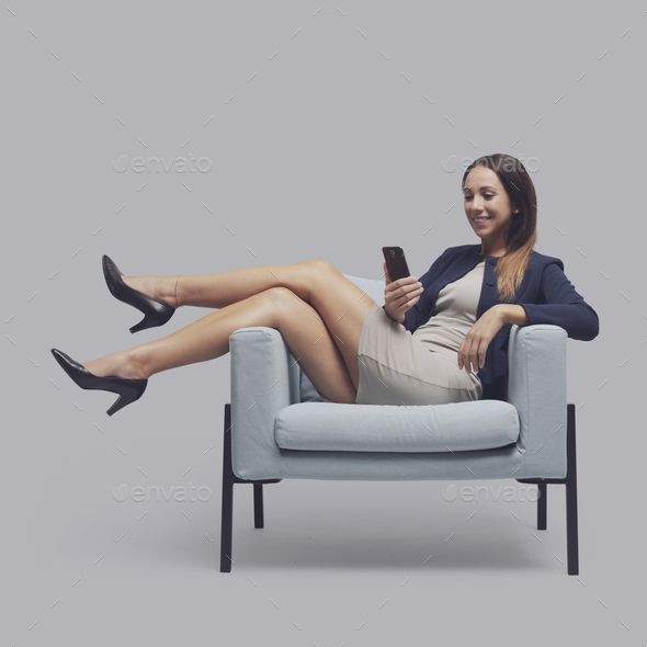 Businesswoman videocalling with her smartphone - Stock Photo - Images