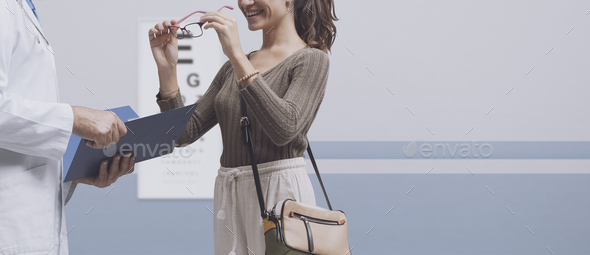 Woman wearing her new glasses - Stock Photo - Images
